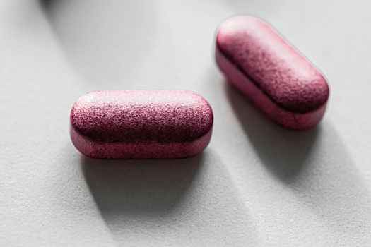 Pink pills as herbal medication, pharma brand store, probiotic drugs as nutrition healthcare or diet supplement products for pharmaceutical industry ads