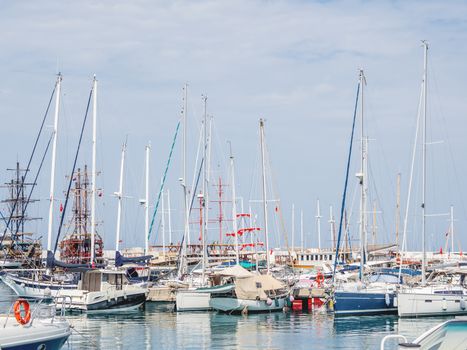 Yachts are moored at the Grand Marina, Kemer, Turkey. Beautiful ships for tourist trips on the Mediterranean sea.