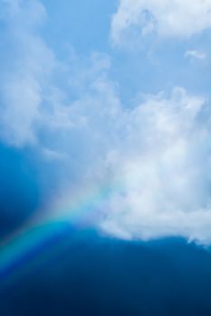 Rainbow in a dreamy blue sky, spiritual and nature backgrounds