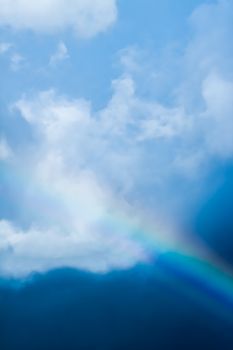 Rainbow in a dreamy blue sky, spiritual and nature backgrounds