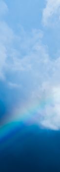 Rainbow in a dreamy blue sky, spiritual and nature backgrounds