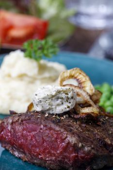 grilled steak with roasted onions