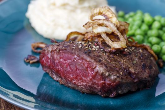 grilled steak with roasted onions