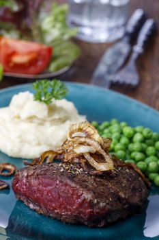 grilled steak with roasted onions