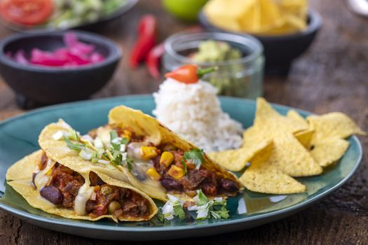 mexican tacos with rice on wood