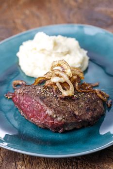 grilled steak with roasted onions