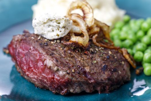 grilled steak with roasted onions