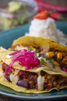 mexican tacos with rice on wood