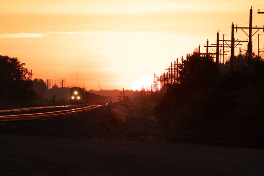 Rail Road crossing and tracks at sunset . High quality photo