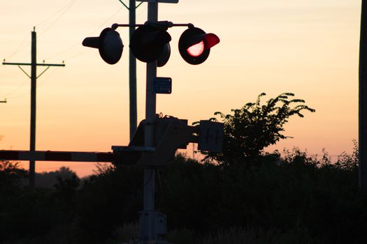 Rail Road crossing and tracks at sunset . High quality photo