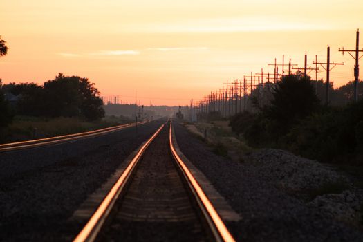 Rail Road crossing and tracks at sunset . High quality photo