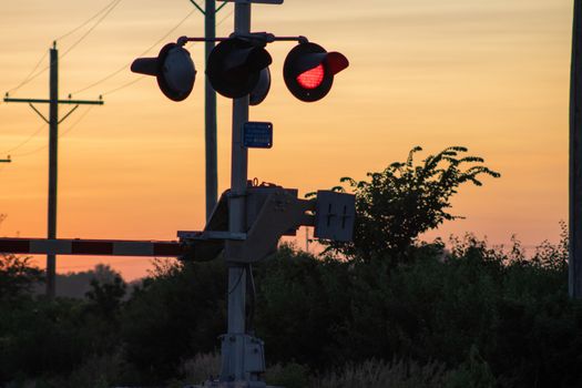 Rail Road crossing and tracks at sunset . High quality photo