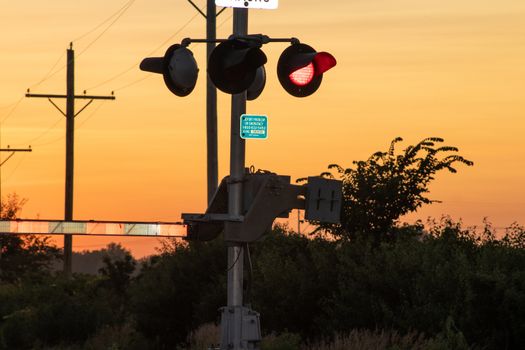 Rail Road crossing and tracks at sunset . High quality photo