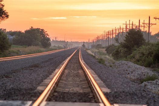 Rail Road crossing and tracks at sunset . High quality photo