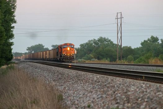 Rail Road crossing and tracks at sunset . High quality photo