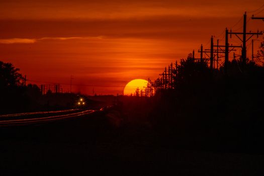 Rail Road crossing and tracks at sunset . High quality photo