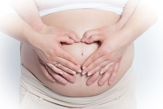 A belly of a pregnant woman, she is waiting for a miracle