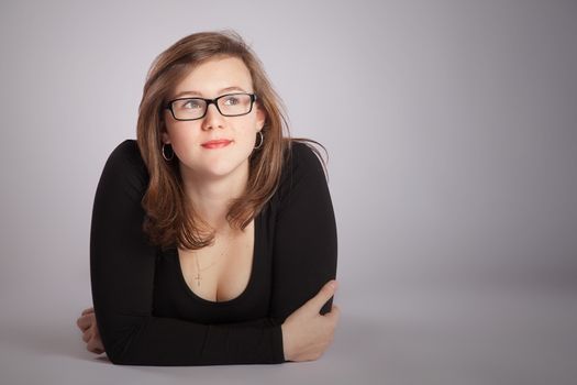 Young woman is laying on the floor