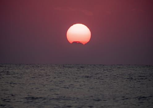 big sun down over sea sunrise, red sky