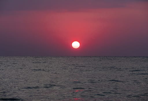 big sun down over sea sunrise, red sky