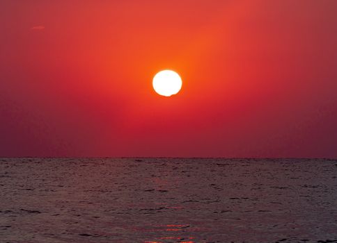 big sun down over sea sunrise, red sky