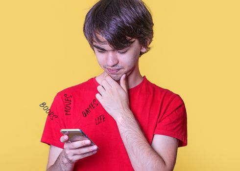 A young man in a red shirt chatting and living on the phone