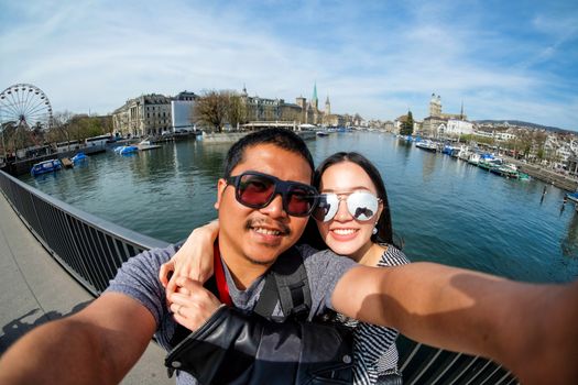 Young Couple taking selfie with mobile phone  in Zurich, Switzerland 