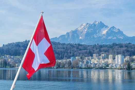 Panoramic view of cityscape center of Lucerne in daylight with Swiss flag,Switzerland