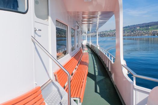 The outside deck of a ferry on lake Lucerne
