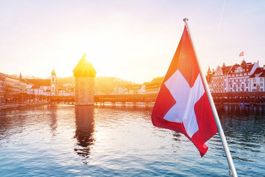 Panoramic view of city center of Lucerne with famous Chapel Bridge and lake Lucerne with Swiss flag, Switzerland