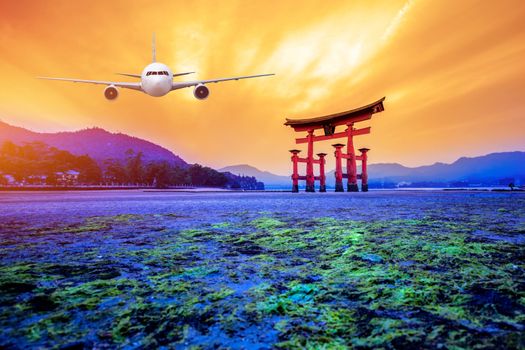 Real airplane over the Tori gate with the view of Hiroshima, Japan