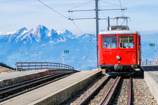 Famous electric red tourist swiss train on Rigi mountain,Switzerland,Europe