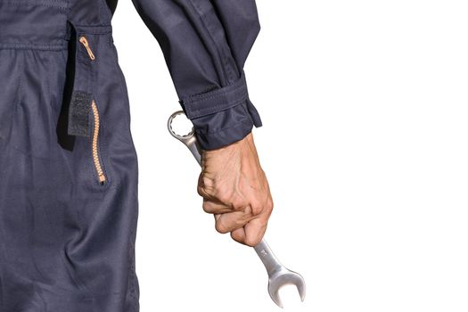 Car repairman wearing a dark blue uniform standing and holding a wrench that is an essential tool for a mechanic isolated on white background, Automotive industry and garage concepts.