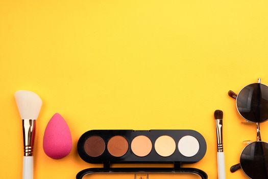 Professional cosmetics palette with eyeshadow makeup brushes cropped look. High quality photo