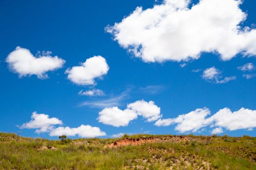 A landscape pictures of the country of Madagascar, with mountains and meadows