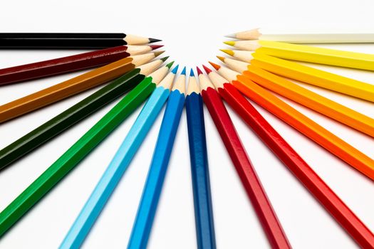 Some colorful wooden pencils on a white background