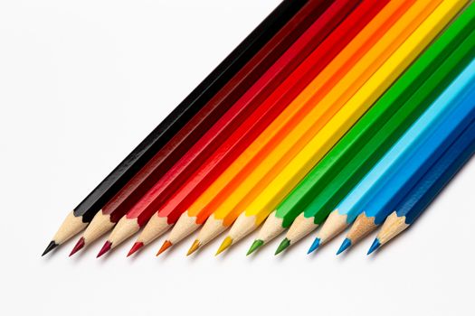 Some colorful wooden pencils on a white background