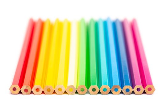 Some colorful wooden pencils on a white background