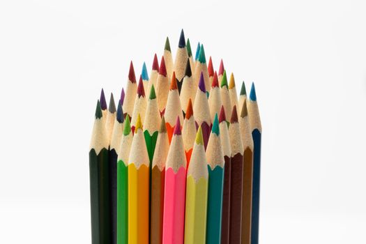Some colorful wooden pencils on a white background