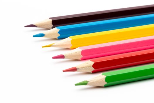 A Colorful color wooden pencils on a white background
