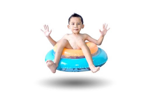 Cute Asian boy sitting on the colorful swim rings isolated on white background.