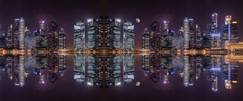 Panoramic view at night of  a megalopolis skyscrapers  with reflection  of Singapore city.