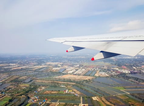 The view from the window of the plane while flying in the sky.