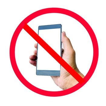 Hand holding smart phone with do not use smart phone sign isolated on white background.