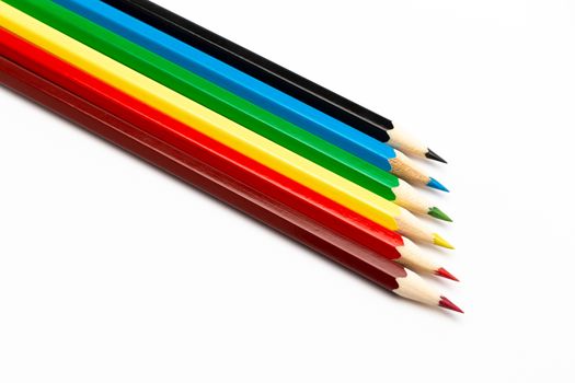 Some colorful wooden pencils on a white background