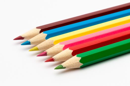 A Colorful color wooden pencils on a white background