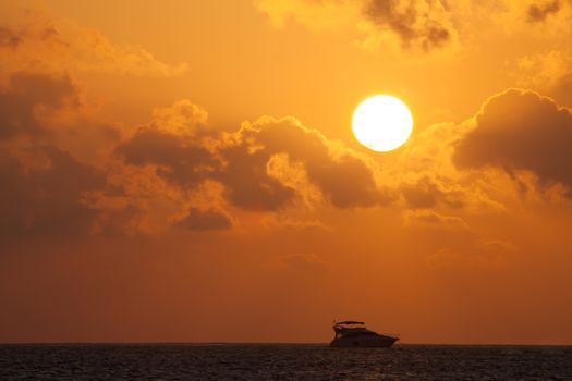 Sunset with a view to the ocean with boats