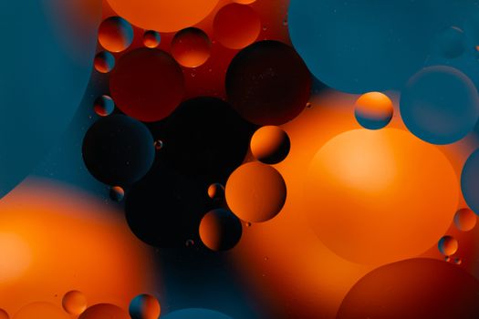 a Close-up water and oil abstract in a rainbow lighting effect