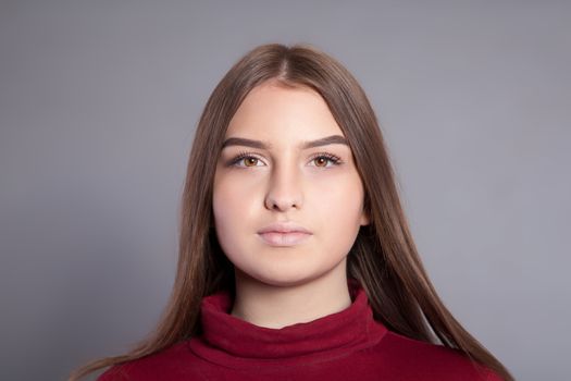 Face of a young woman with long hair