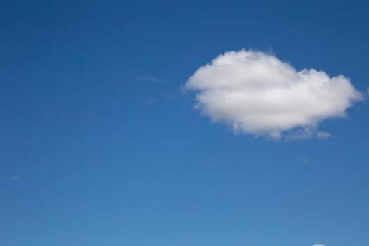 The blue sky with a white cloud